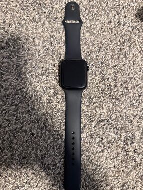 Apple Watch SE 44mm with charger cord
